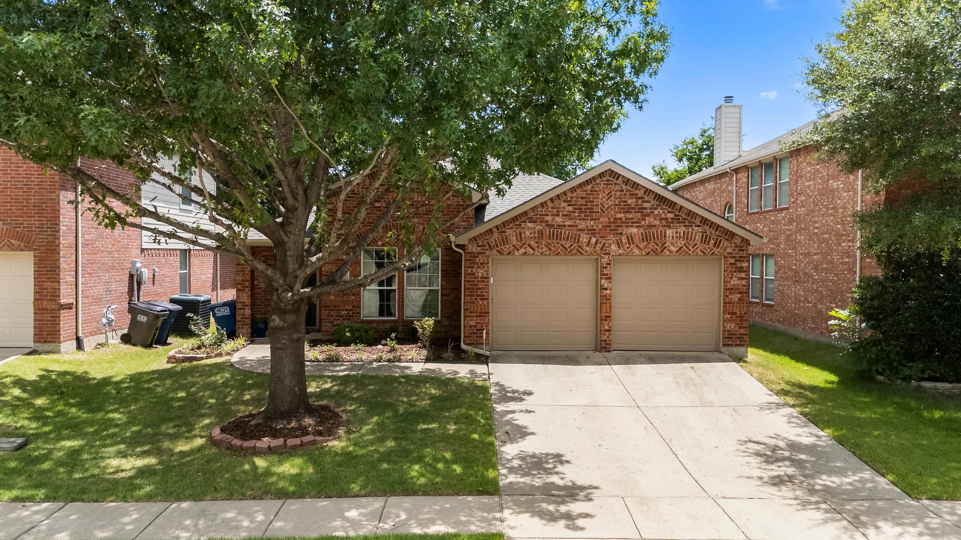 Shaded front lawn at 2015 Highland Drive in Wylie, Texas
