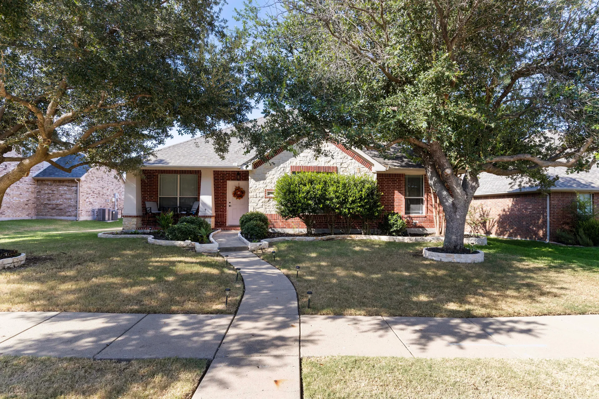 Brick and stone single-story home at 2708 Sugar Maple Drive in Wylie, Texas