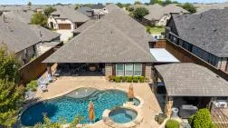 Aerial view of a pool and patio prepared for a DFW property listing